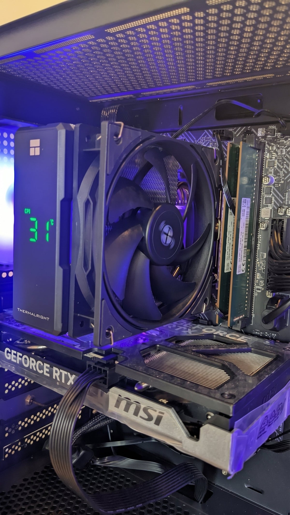 Gaming PC front view with teal and green RGB fans