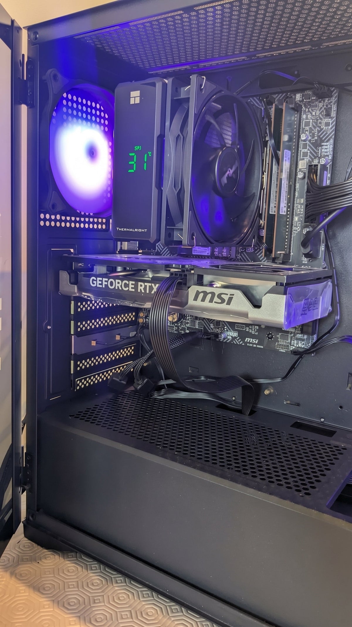 Gaming PC front view with teal RGB fans on white background